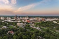 Aerial view of downtown Durham with skyline and surrounding neighborhoods